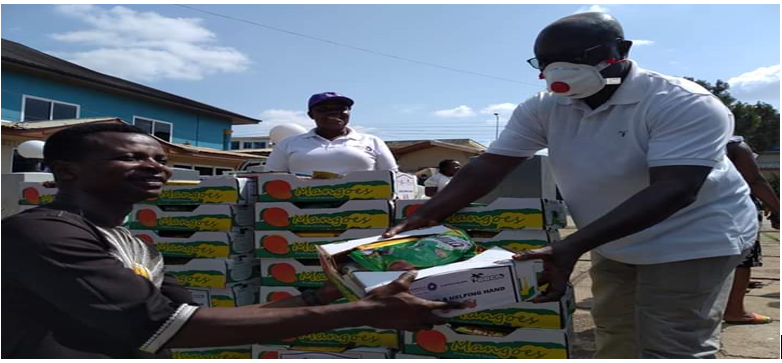 •	A BENEFICIARY RECEIVING HIS BOX FROM THE KUMASI MAYOR